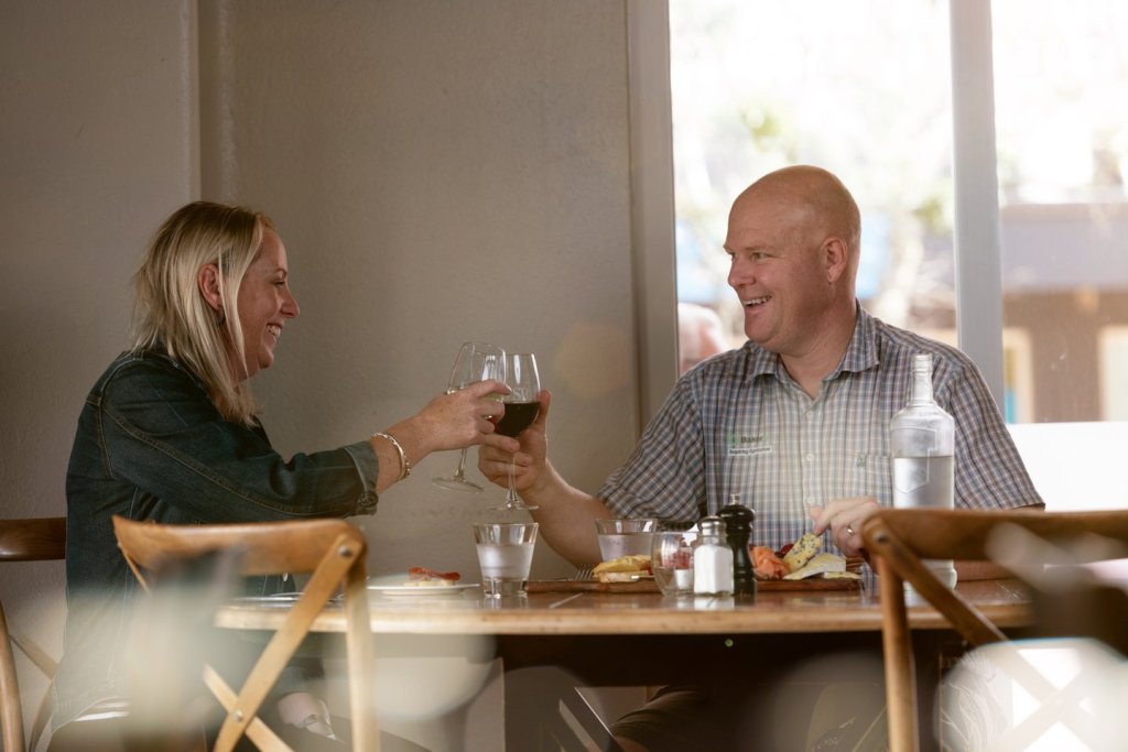 Couple sharing wine at The Strong Room in Manawatu & Feilding