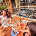 Thumbnail of http://Family%20eating%20at%20Hansens%20Cafe%20and%20Store%20ManawatuNZ.co%20.nz%20%201