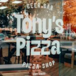 Thumbnail of http://Shopfront%20window%20branding%20at%20Tony's%20Pizza